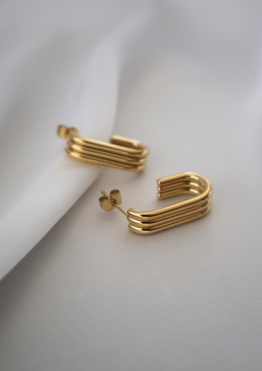 Trivelle gold stud earrings